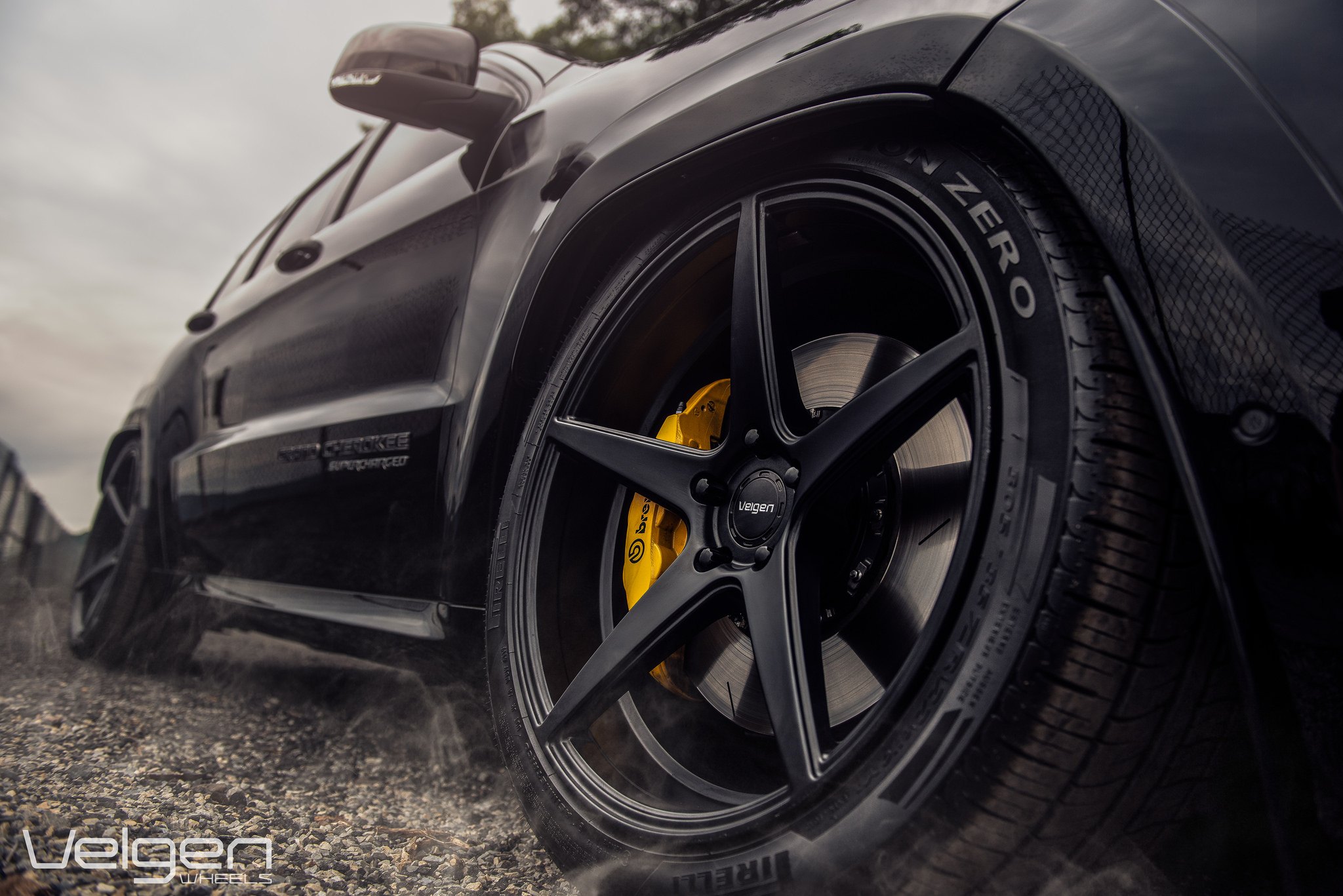 Custom Black Jeep Grand Cherokee SRT on Pirelli Tires - Photo by Velgen