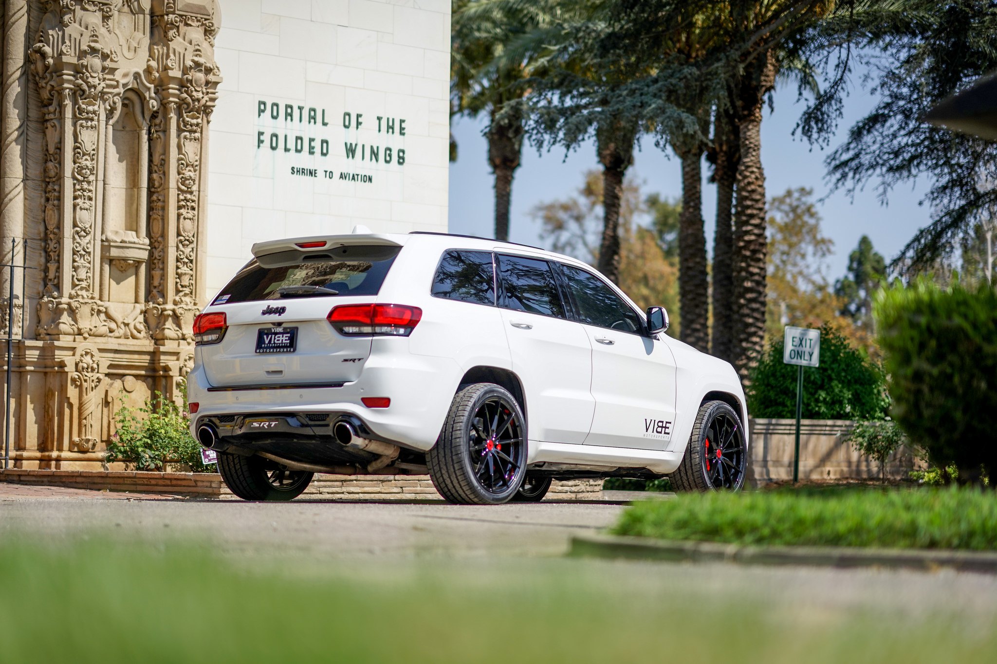 White Jeep Grand Cherokee SRT with Aftermarket Exhaust System - Photo by VIBE Motorsports