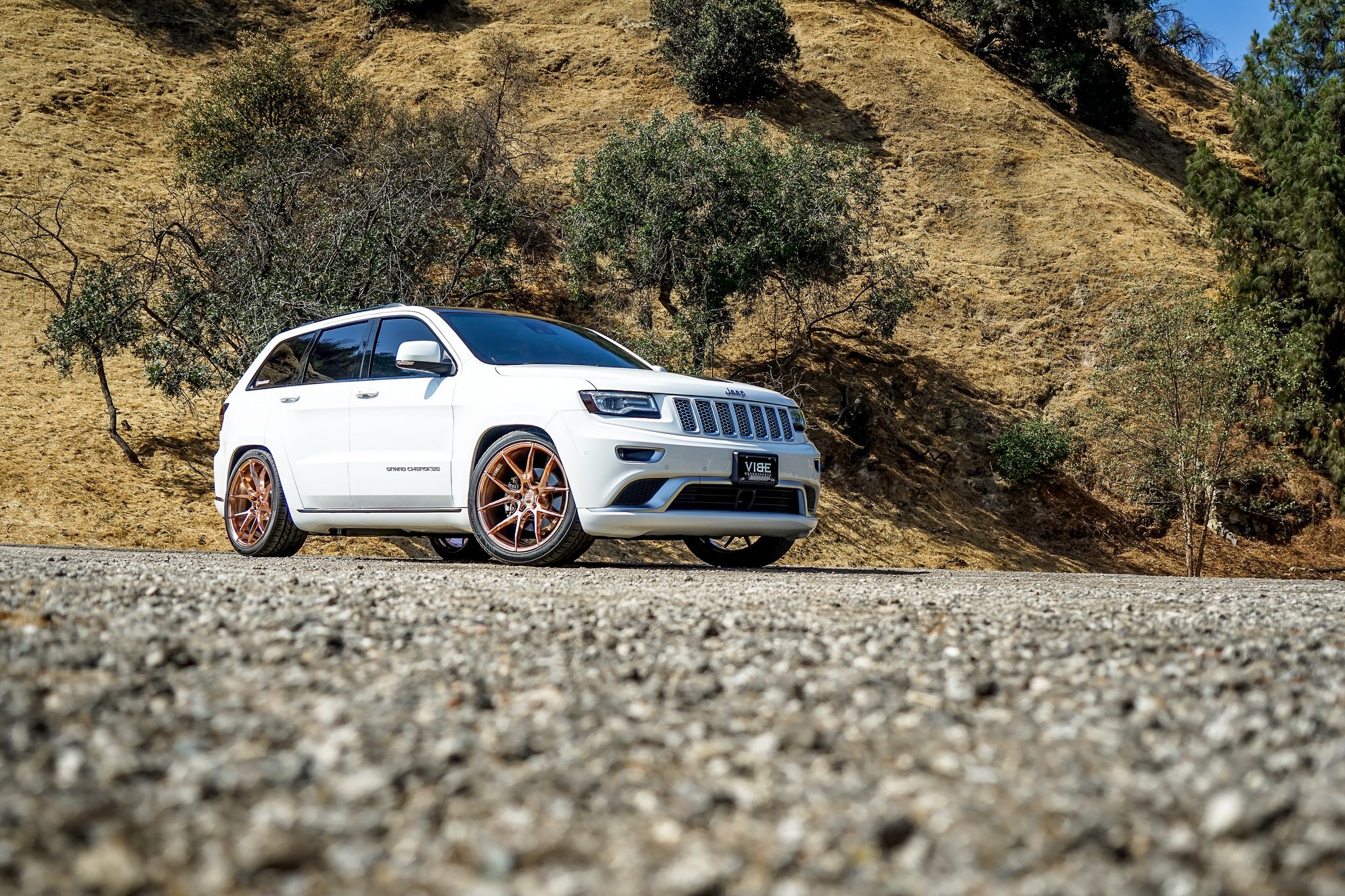 Custom White Jeep Grand Cherokee Front Bumper - Photo by VIBE Motorsports