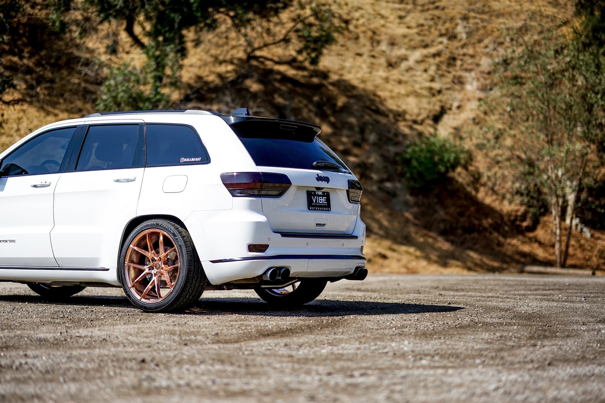 White Jeep Grand Cherokee with Large Roofline Spoiler - Photo by VIBE Motorsports