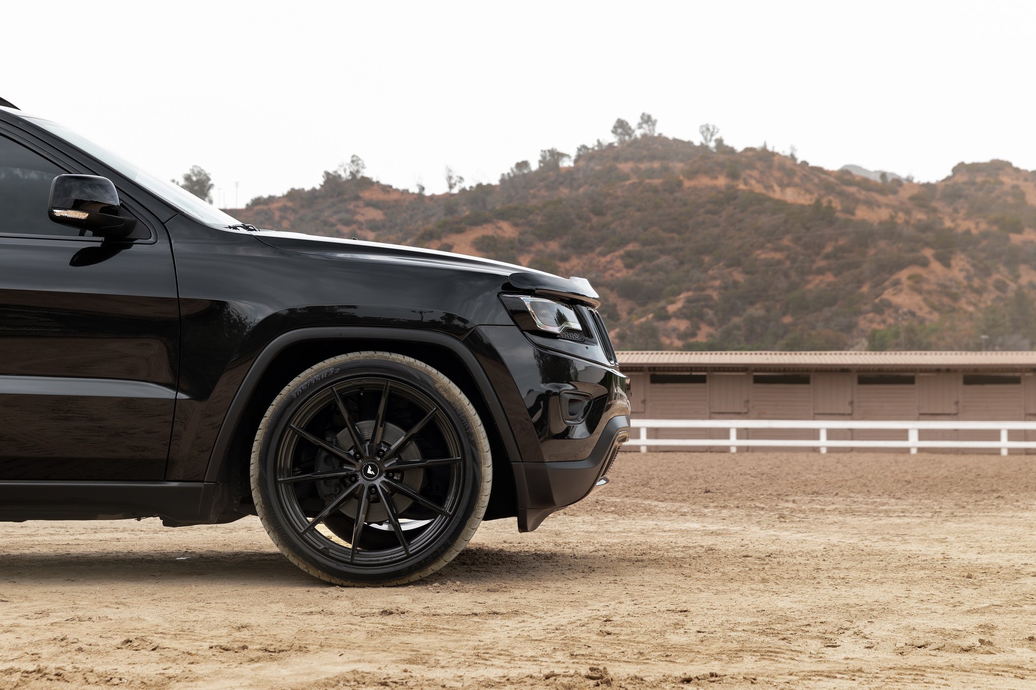 Black Jeep Grand Cherokee with Aftermarket Side Mirrors - Photo by Vorsteiner
