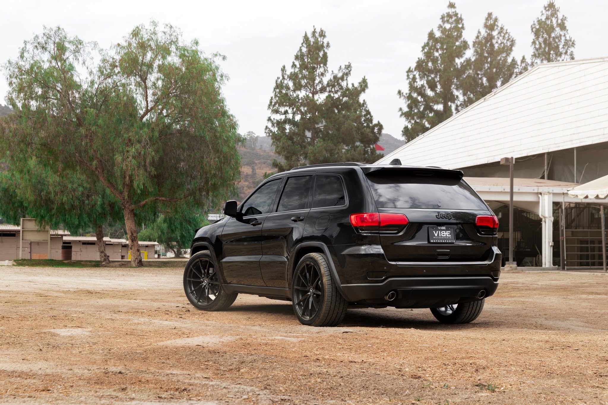 Red LED Taillights on Black Jeep Grand Cherokee - Photo by Vorsteiner