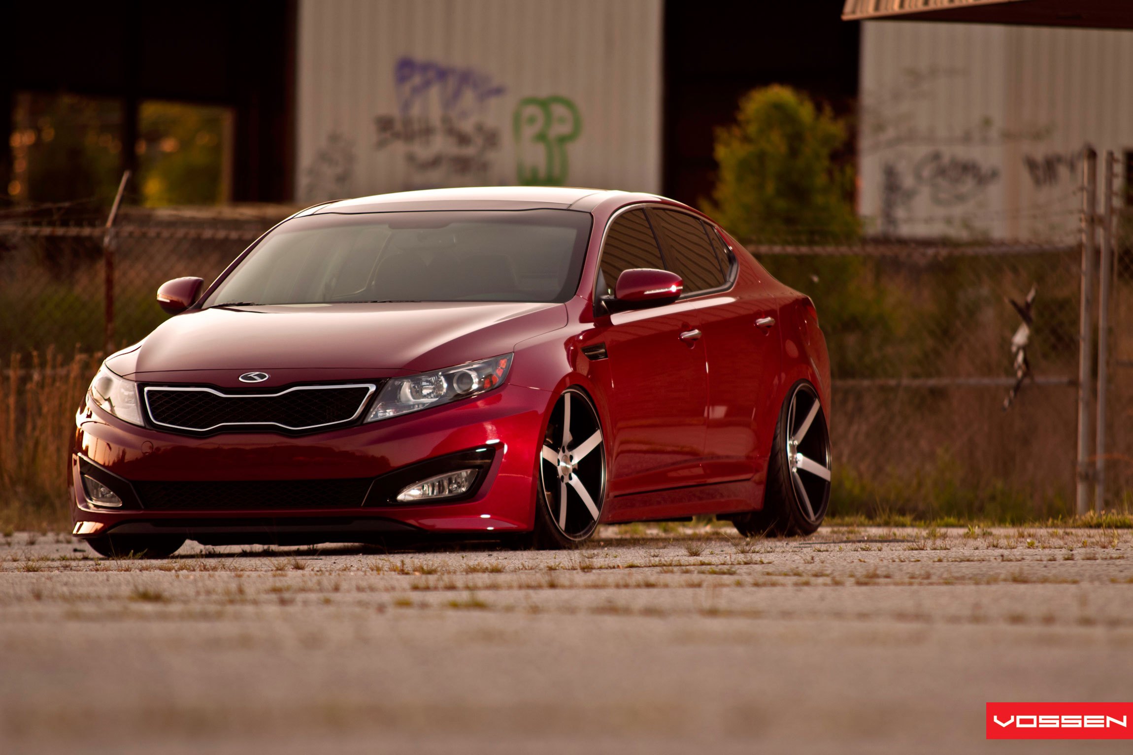 Red Kia Optima with Custom Grille - Photo by Vossen