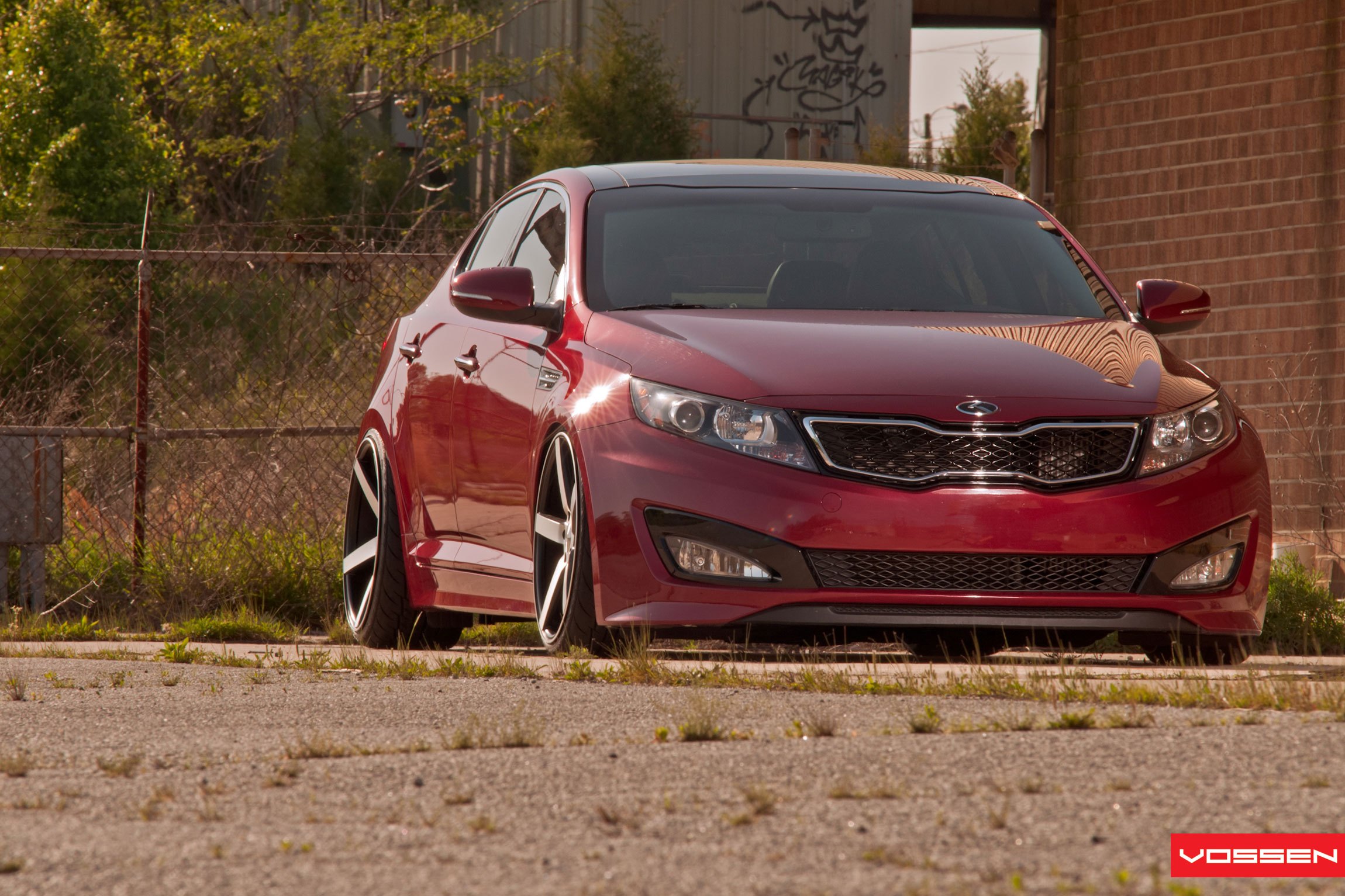 Red Kia Optima with Aftermarket Front Bumper - Photo by Vossen