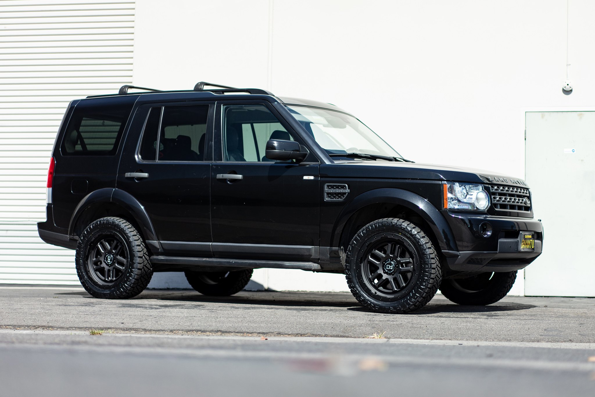 Black Land Rover Discovery with Crystal Clear Headlights - Photo by Black Rhino Wheels
