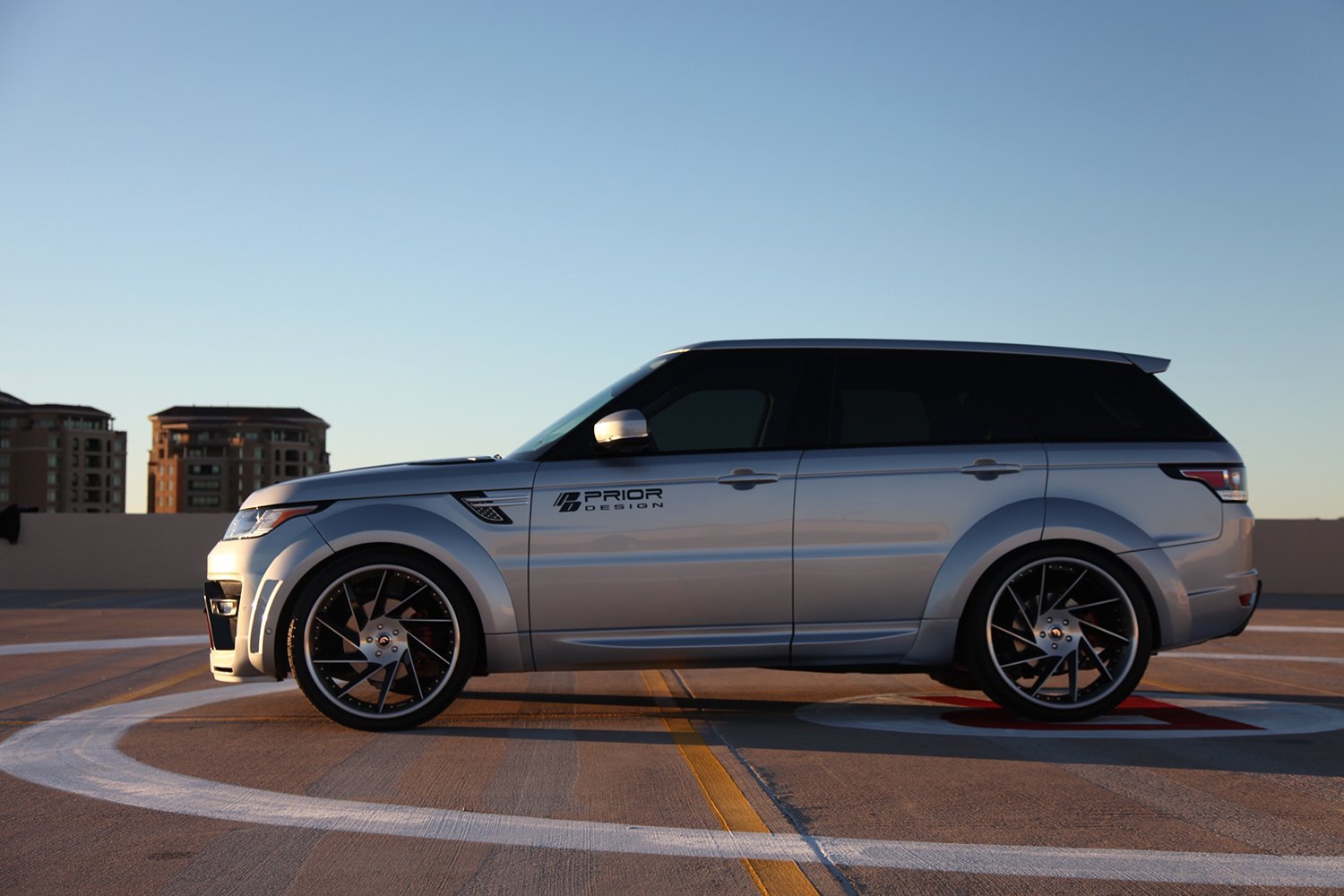 Silver Range Rover Sport with Aftermarket Side Skirts - Photo by Forgiato