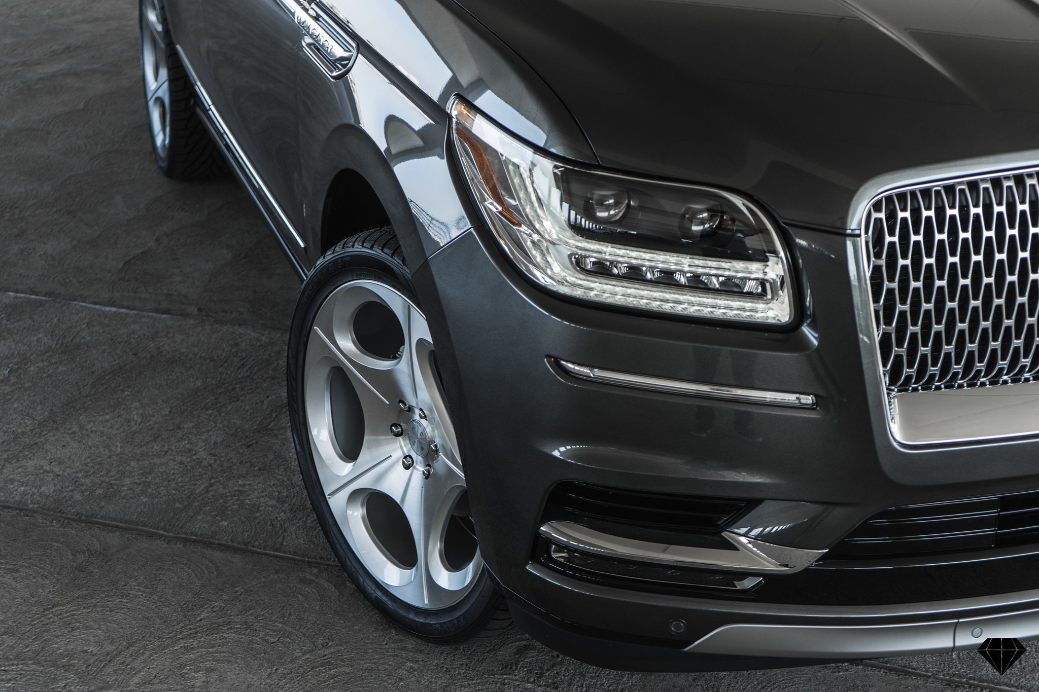 Aftermarket Front Bumper on Gray Lincoln Navigator - Photo by Blaque Diamond Wheels