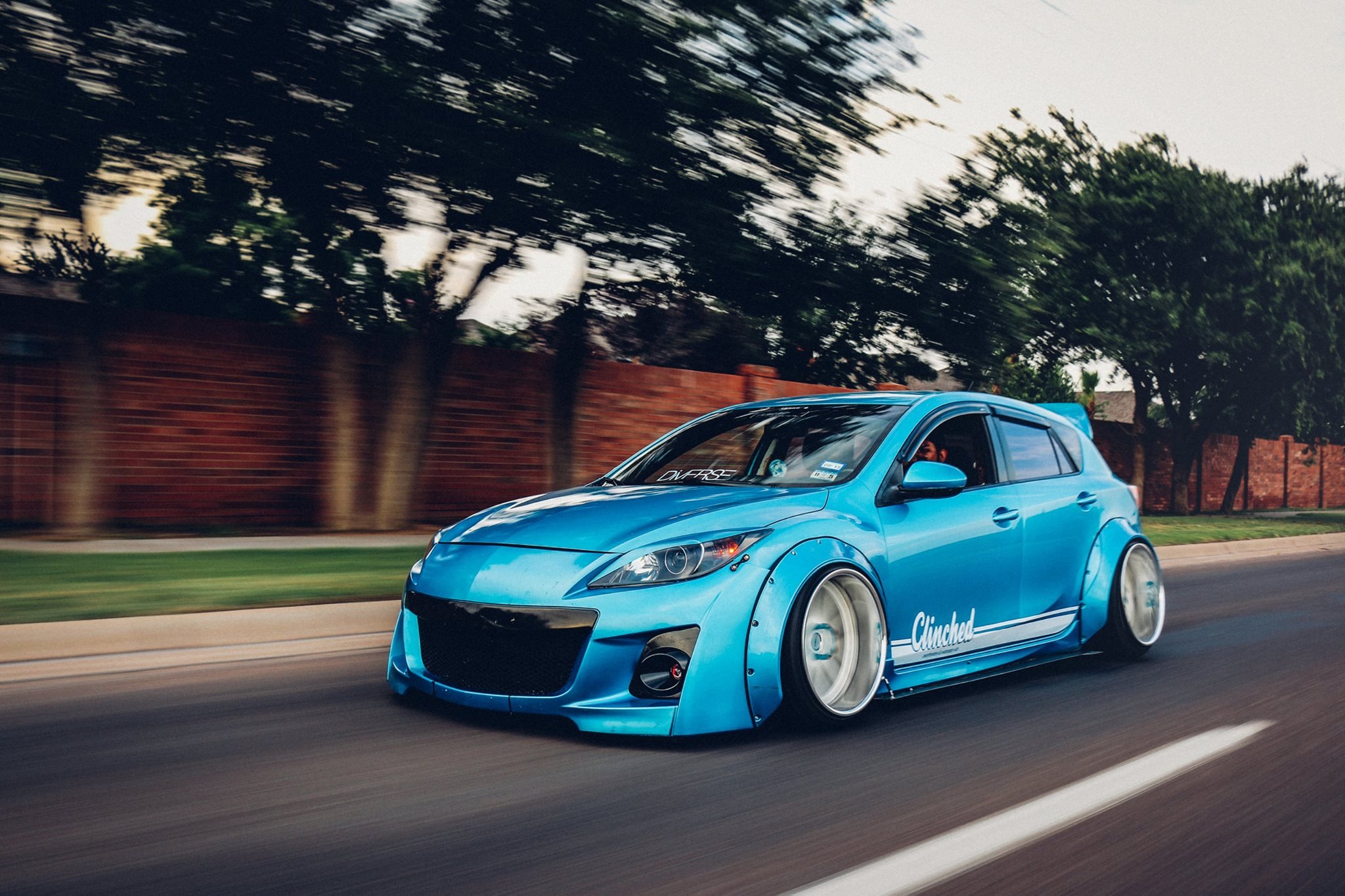 Blue Debadged Mazda 3 with Custom Wheels - Photo by Clinched