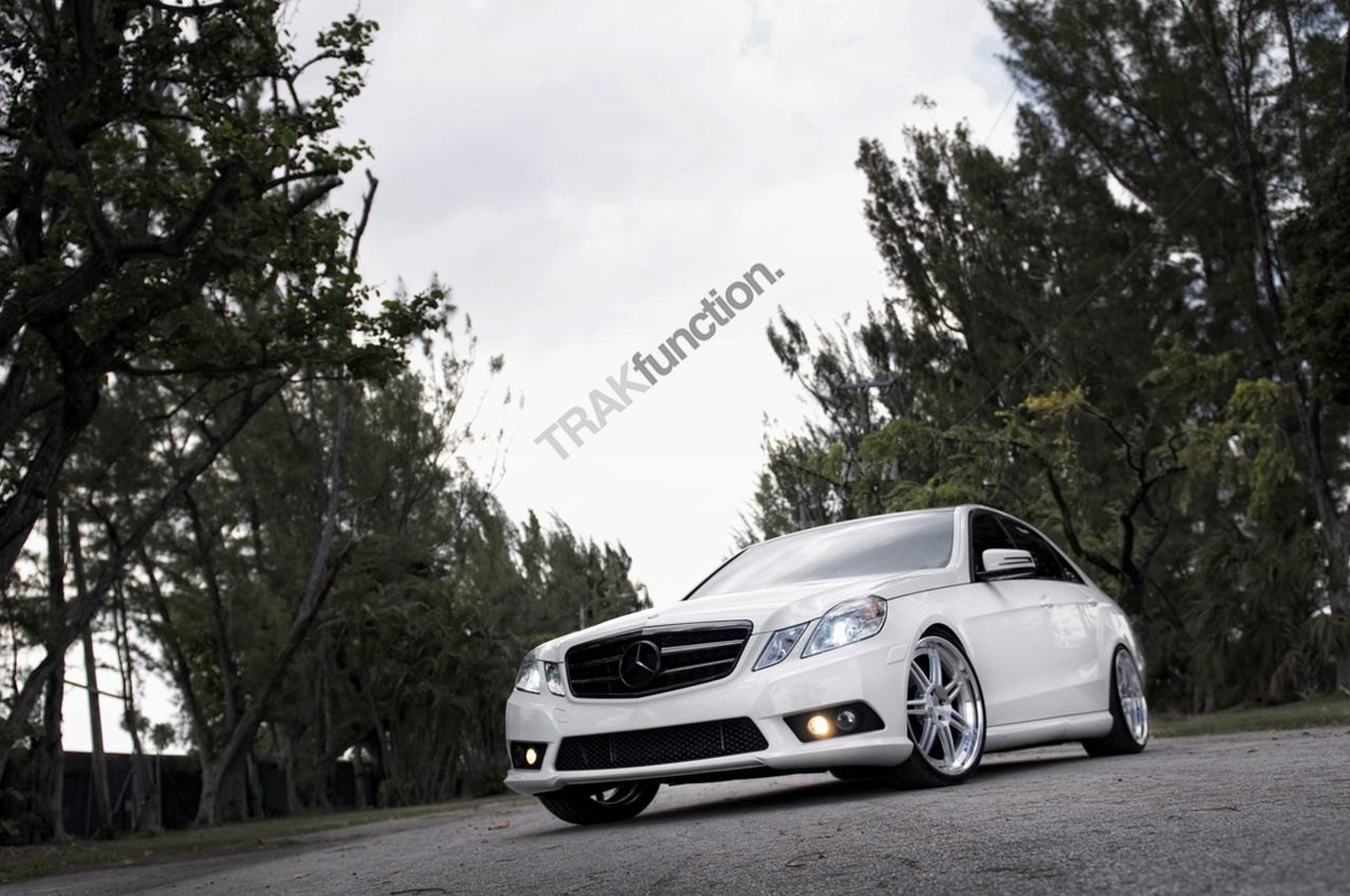 White Benz With Black Tinted Headlights and Taillights - Photo by ADV.1