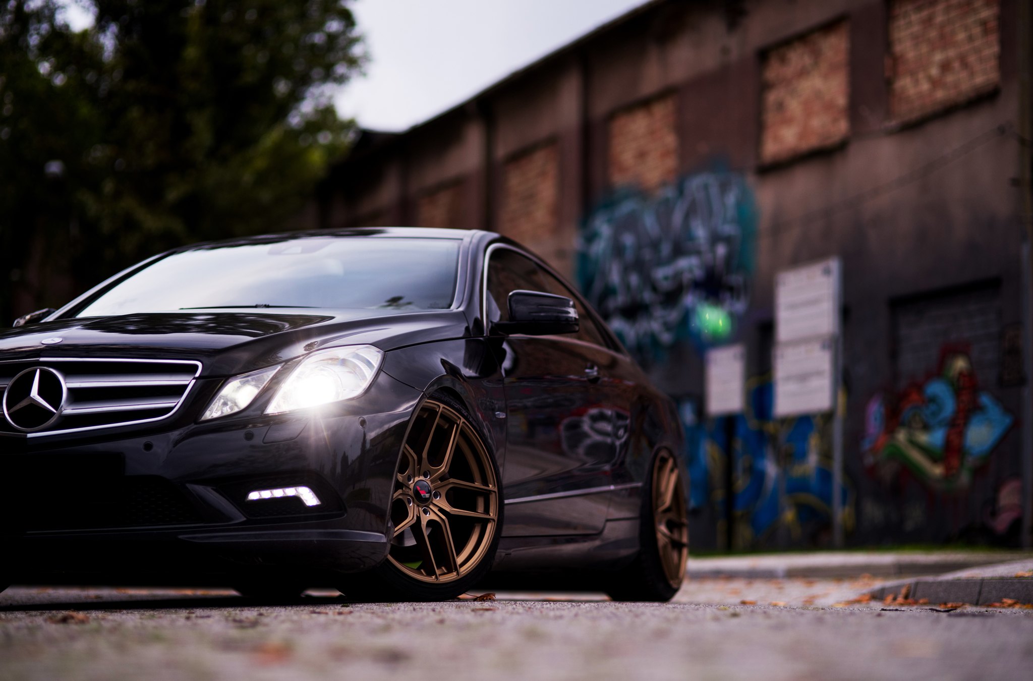 Front Bumper with LED Lights on Black Mercedes E Class - Photo by JR Wheels