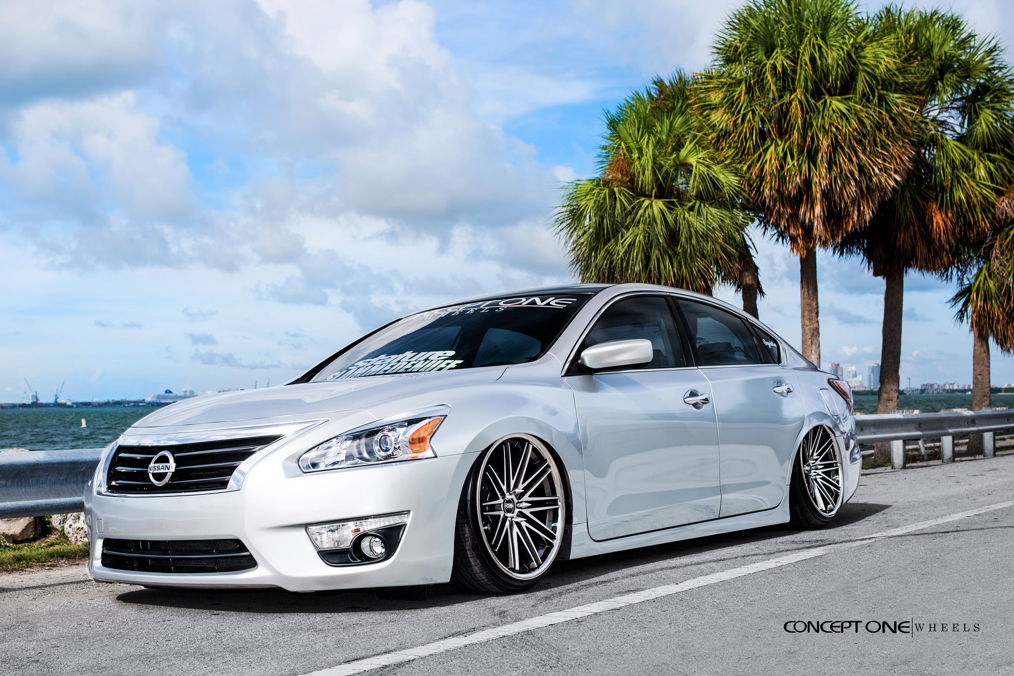 Custom White Pearl Debadged Nissan Altima - Photo by Concept One