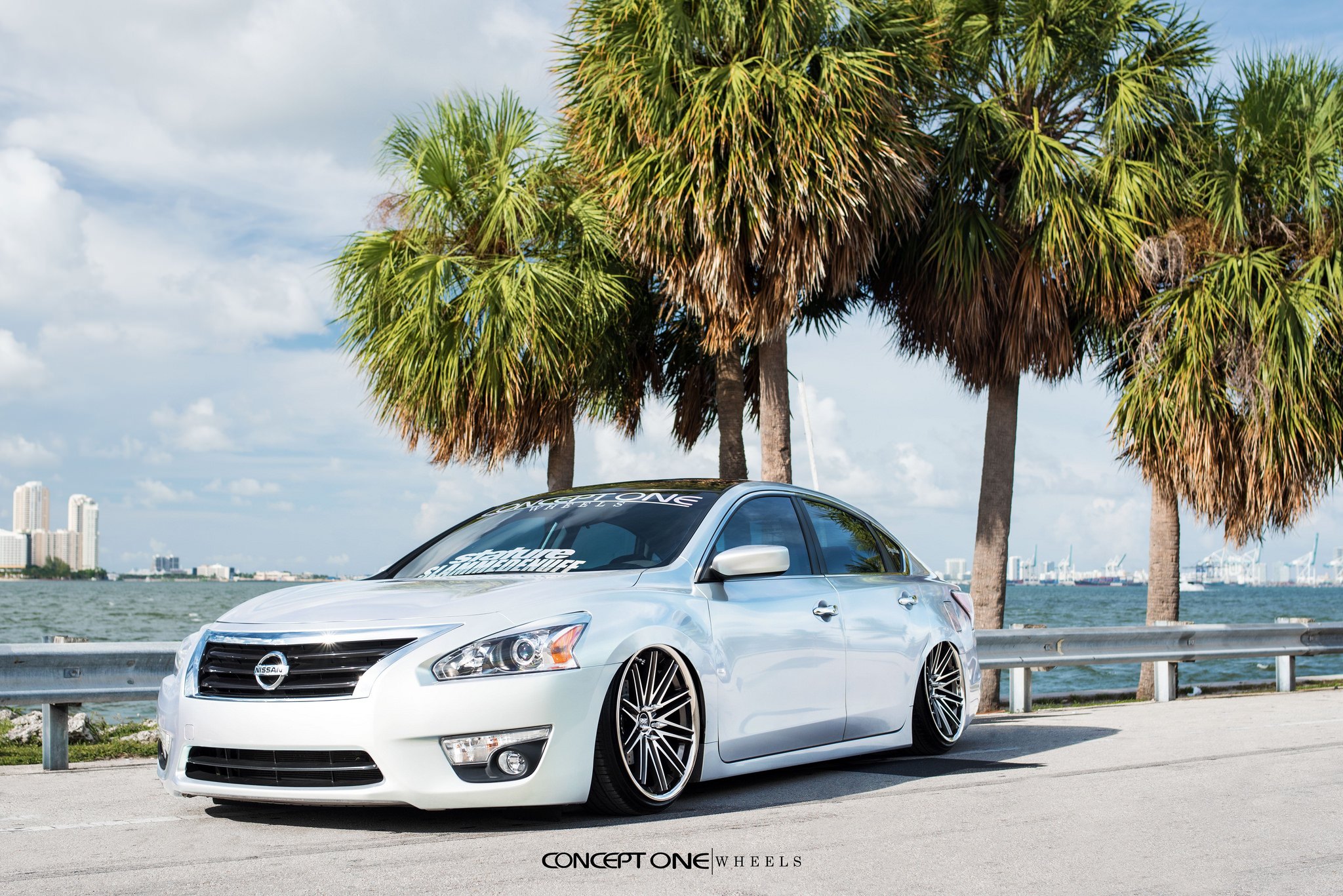 Front Bumper with Fog Lights on White Nissan Altima - Photo by Concept One