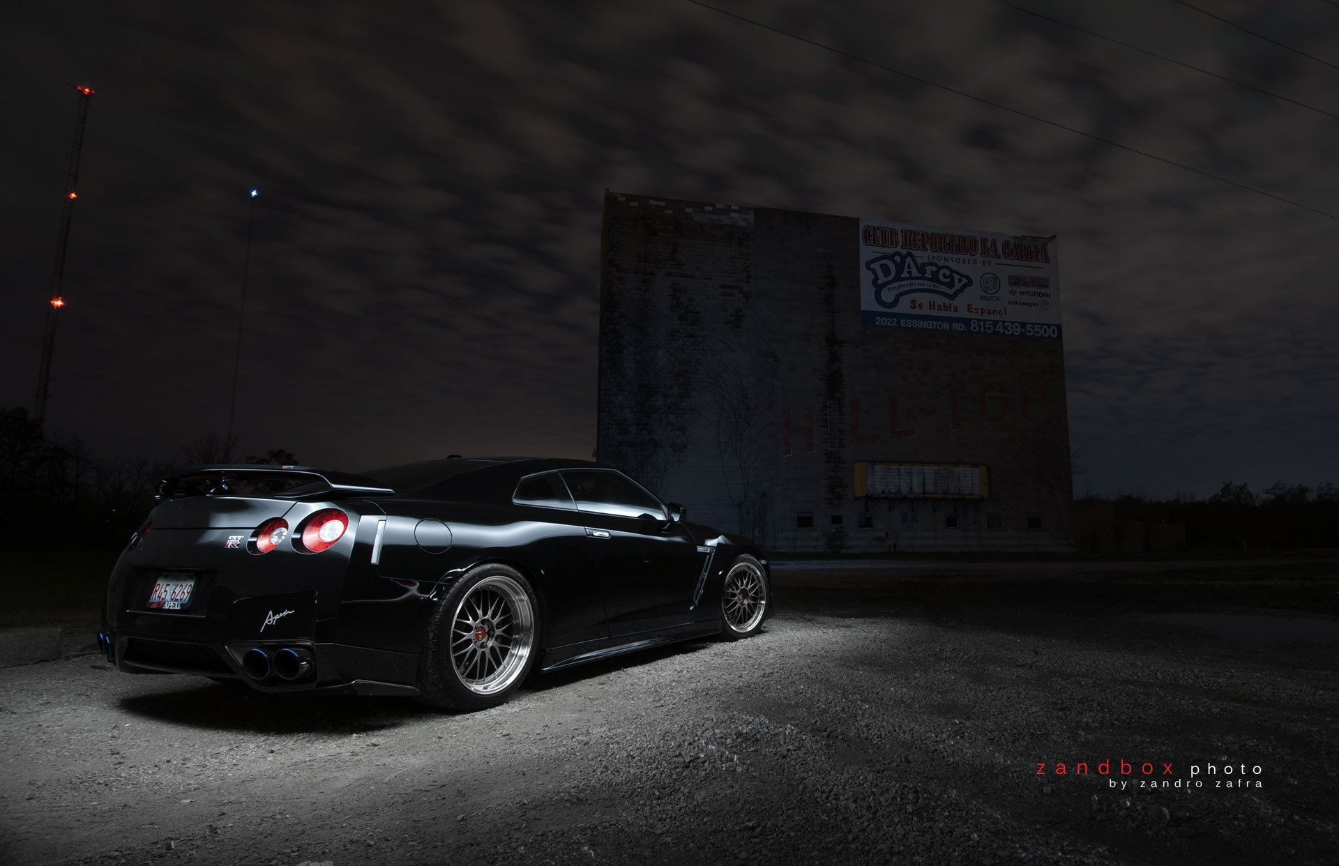 Black Nissan GT-R with Aftermarket Rear Spoiler - Photo by zandbox