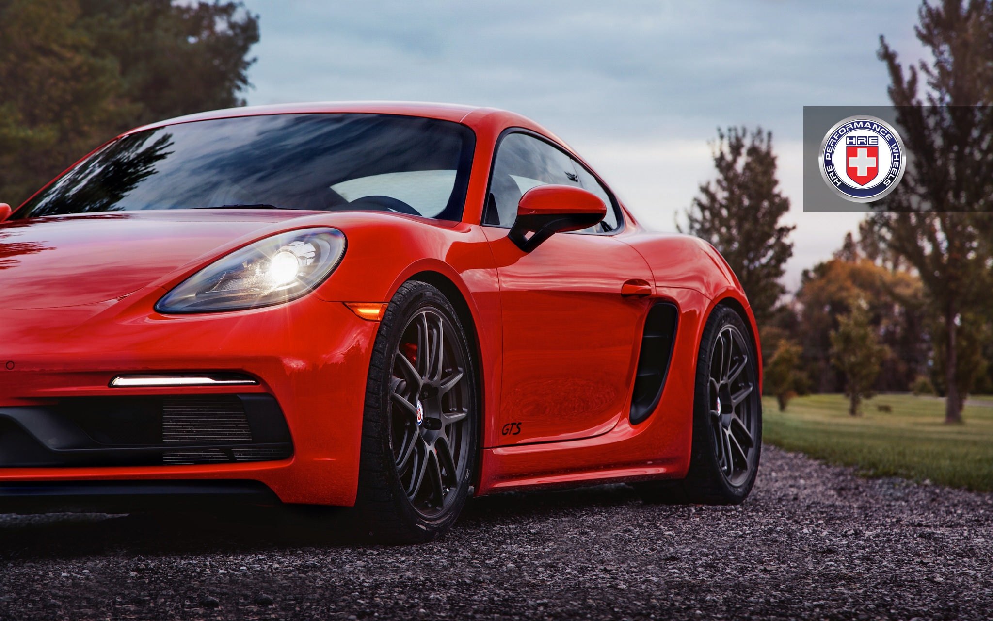 Aftermarket Front Bumper on Red Porsche Cayman - Photo by HRE Wheels