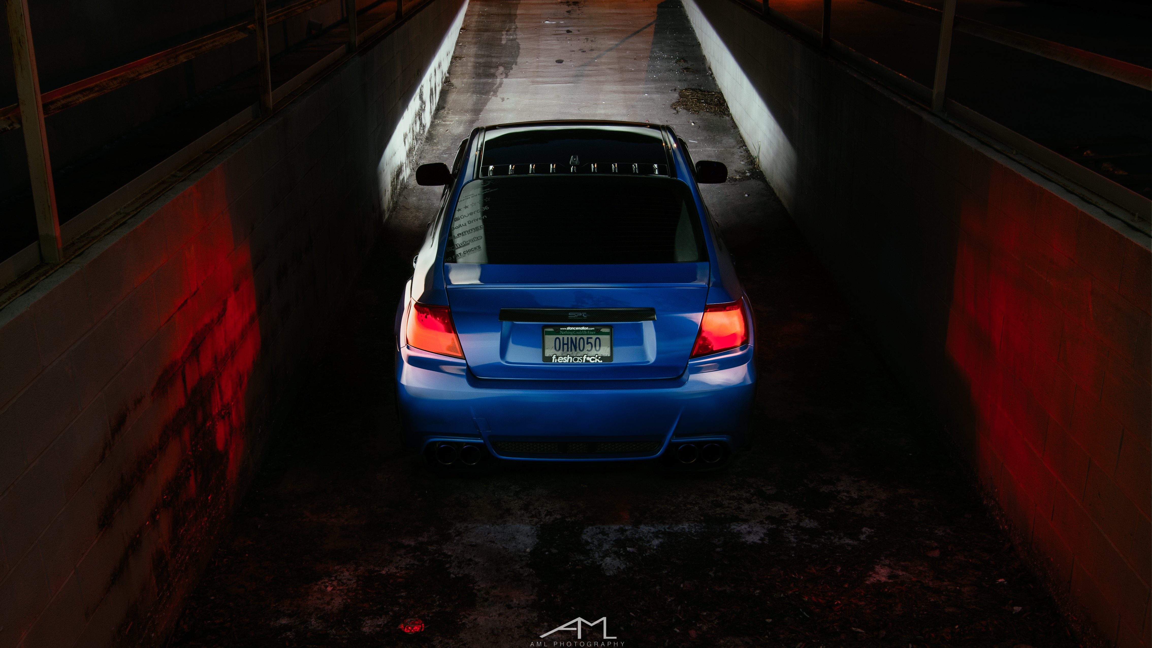 Red LED Taillights on Blue Subaru WRX - Photo by Arlen Liverman