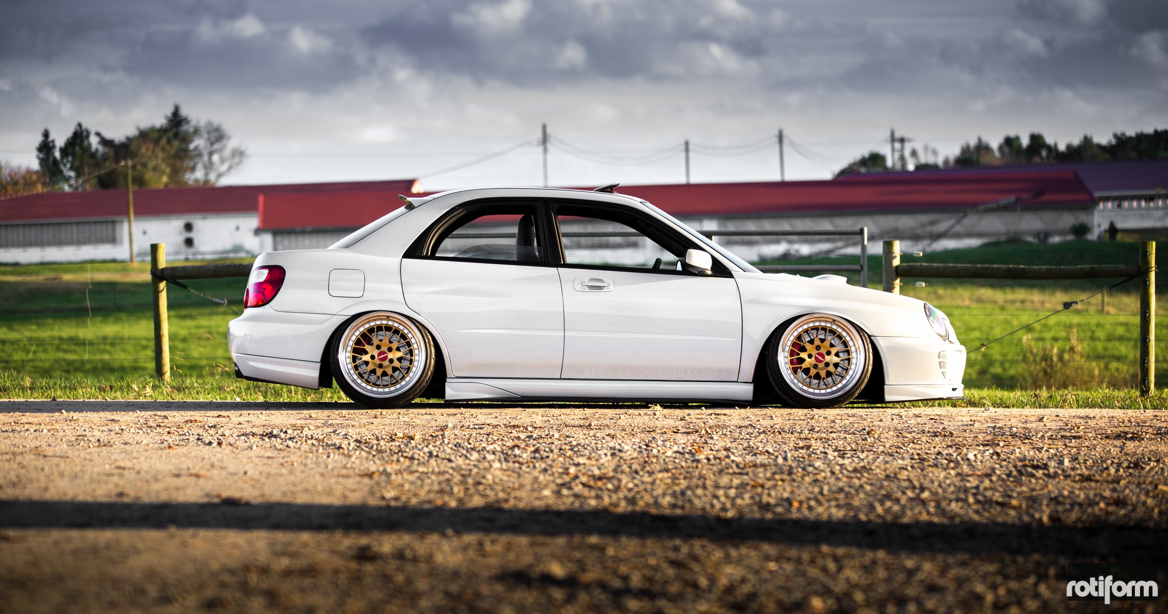 White Subaru WRX with Aftermarket Side Skirts - Photo by Rotiform