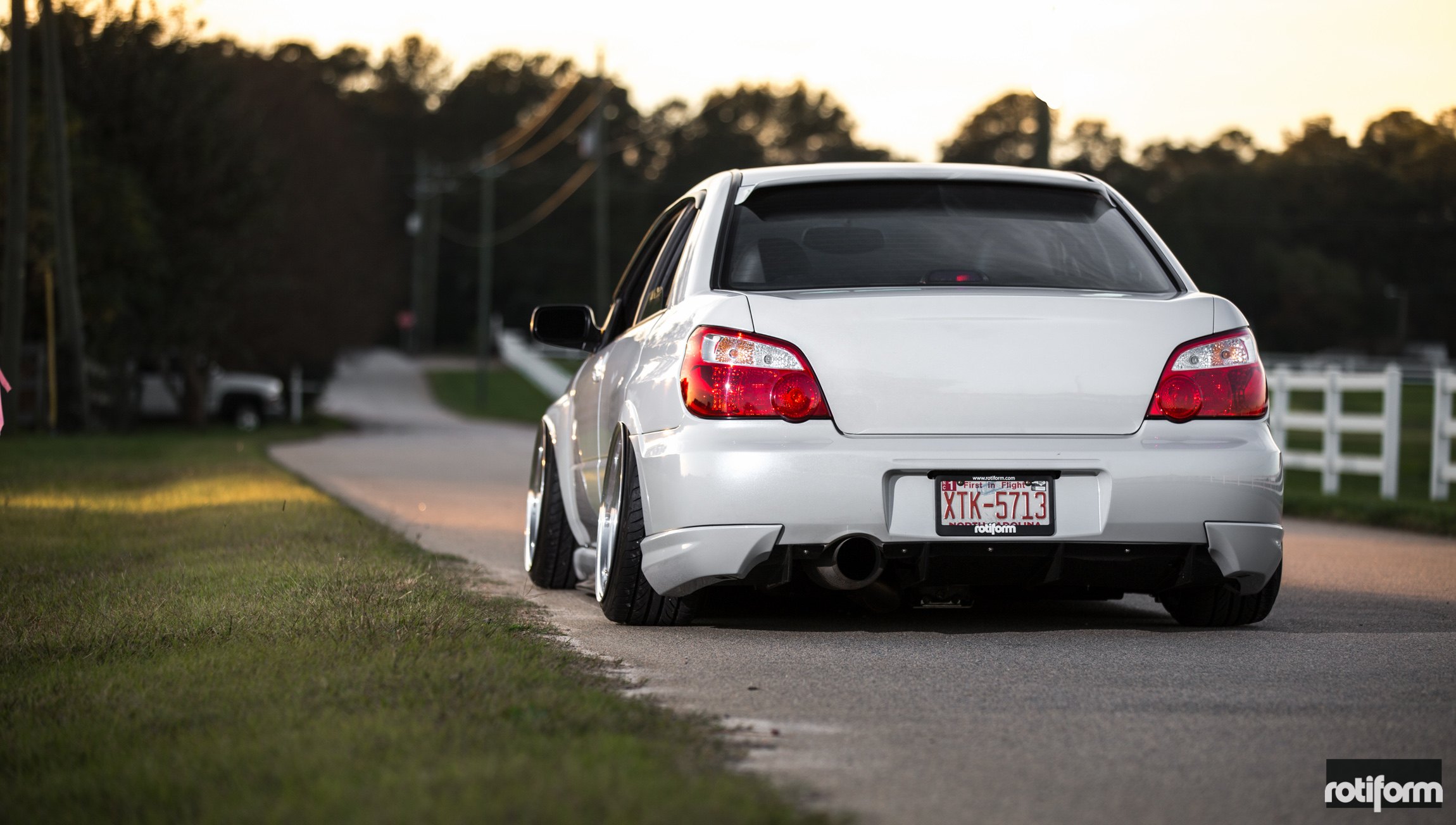White Subaru WRX with Aftermarket Rear Diffuser - Photo by Rotiform