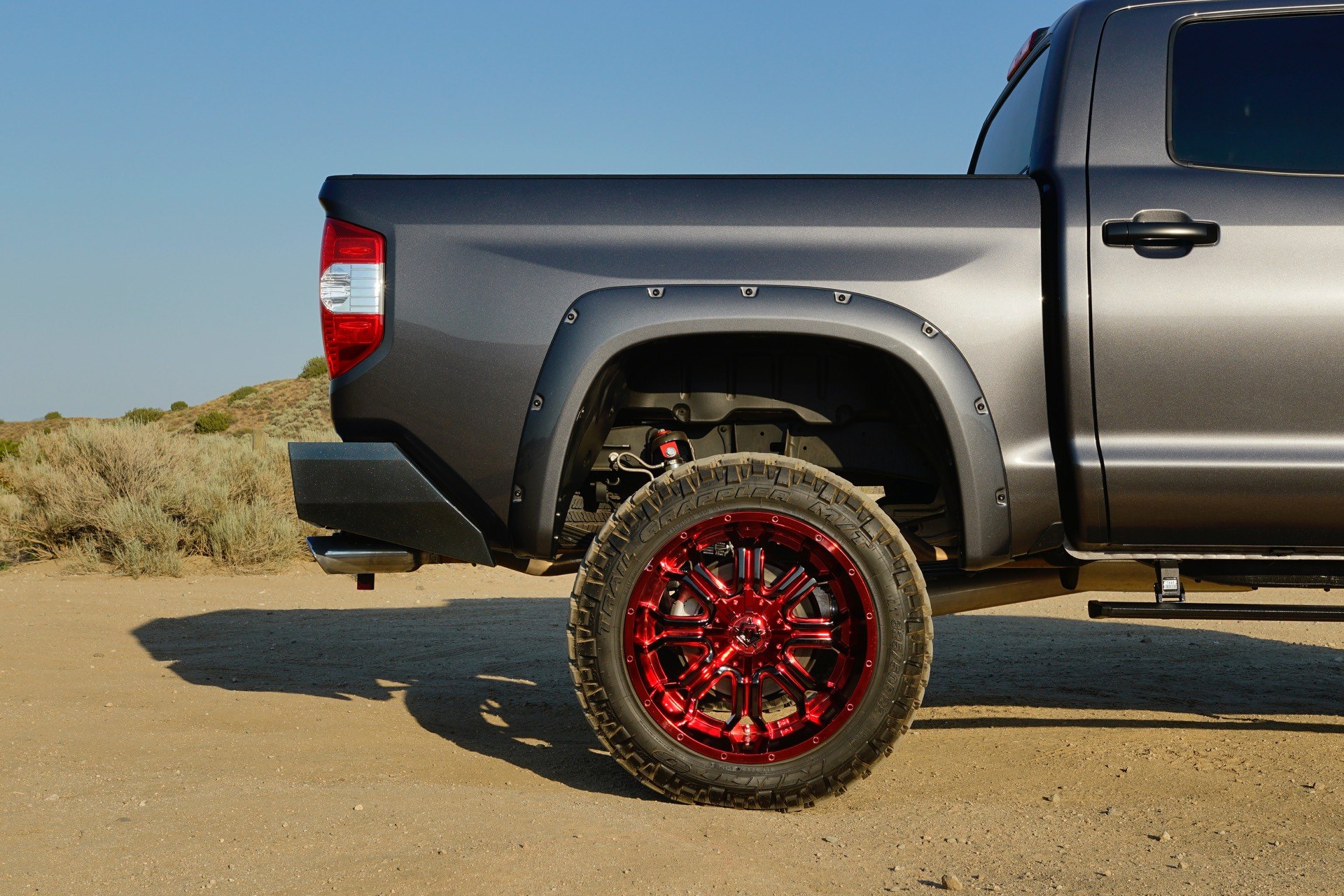Black Lifted Toyota Tundra with Aftermarket Nerf Steps - Photo by TIS Wheels