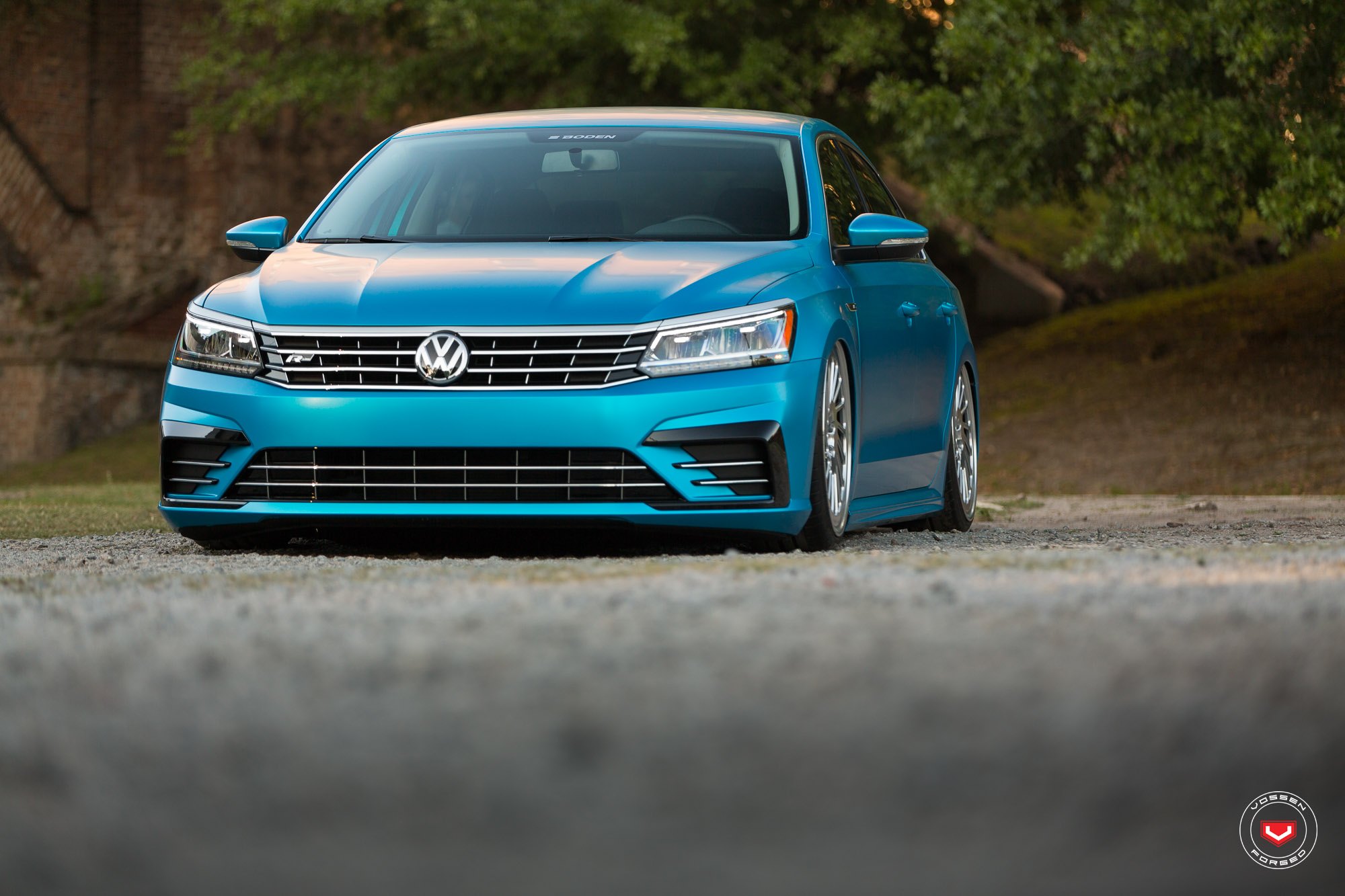 Slammed Passat With a Chrome Blue Wrap on Accuair Suspension and Vossens - Photo by Vossen